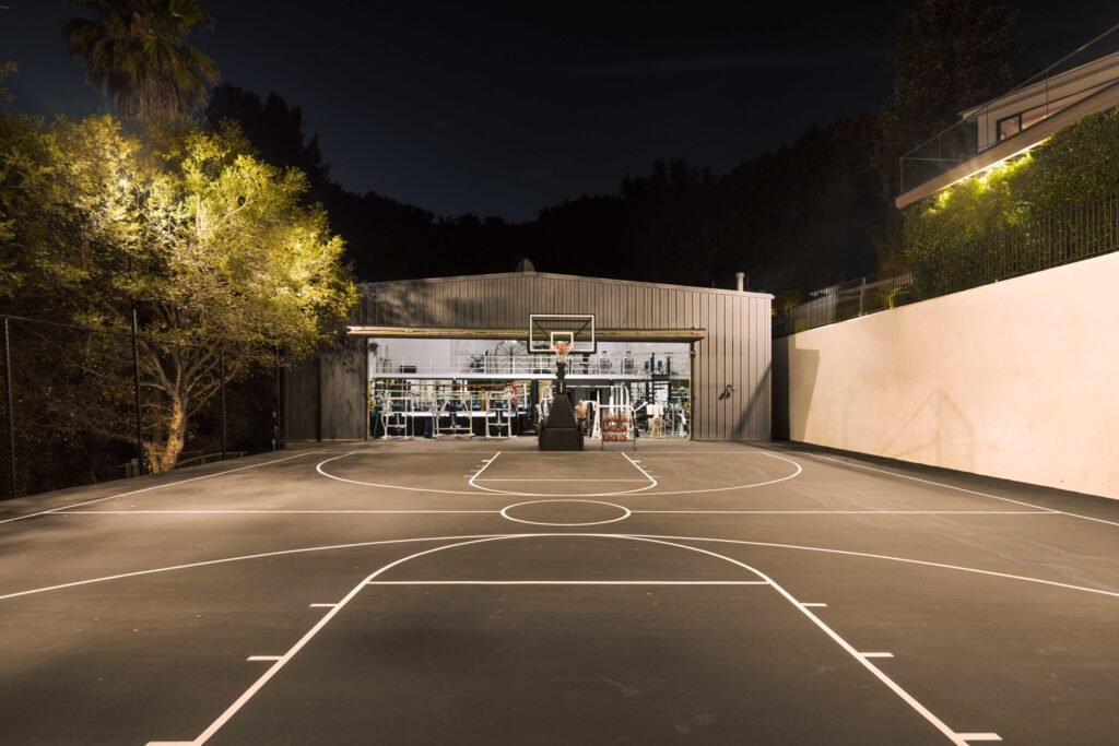 Mark Wahlberg’s former Beverly Hills estate is on the market for \$21.8M featuring seven bedrooms, luxury amenities, a grotto pool, guesthouse, gym and canyon views.